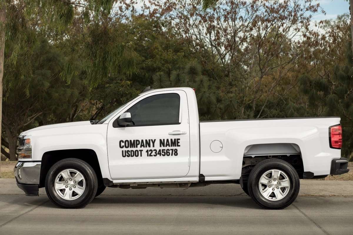Custom Business DOT Vinyl Decal Large Format Sticker For Truck/Car/Van - Rising Sun Decals - Custom Business DOT Vinyl Decal Large Format Sticker For Truck/Car/Van - Rising Sun Decals - White pickup truck with company name and US DOT number on a road with trees in the background